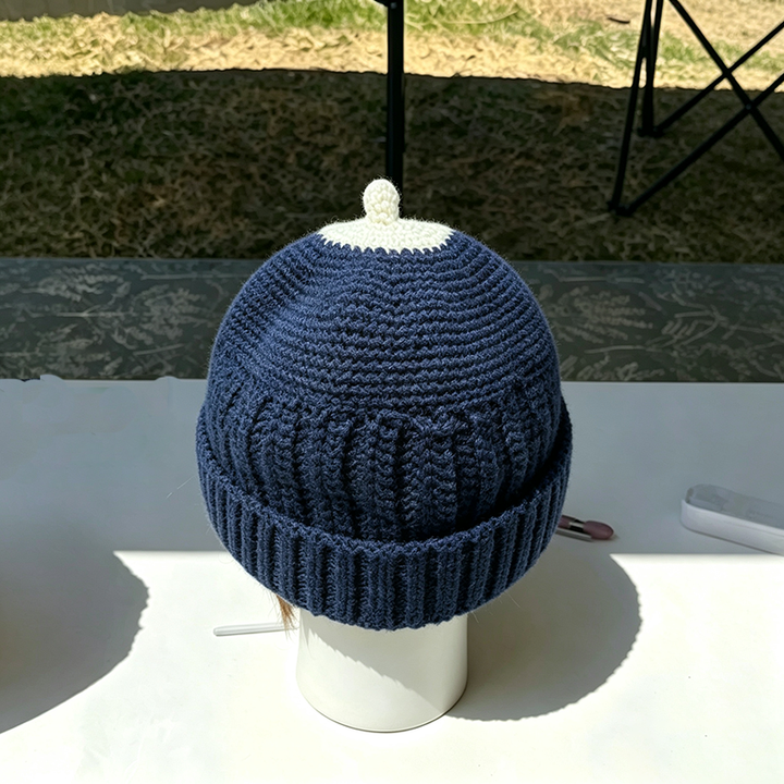 Beanie with a small top knot