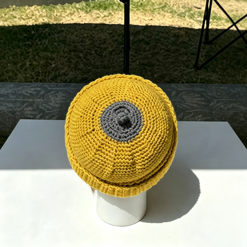 Beanie with a small top knot
