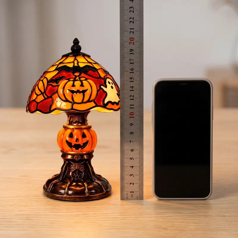 Vintage-style pumpkin and bat pattern table lamp